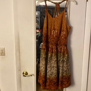 Junior summer dress. It flairs with Elastic ruching in the middle.